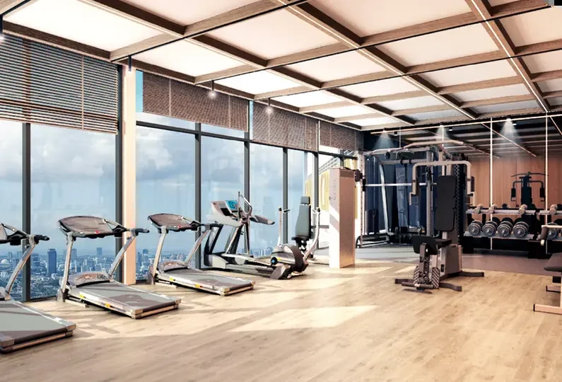 Gymnasium with floor to ceiling windows overlooking the Kuala Lumpur skyline